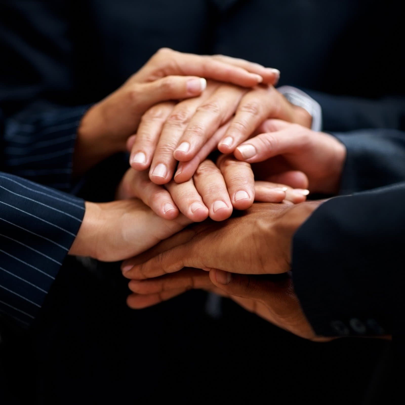 Partners joining hands together